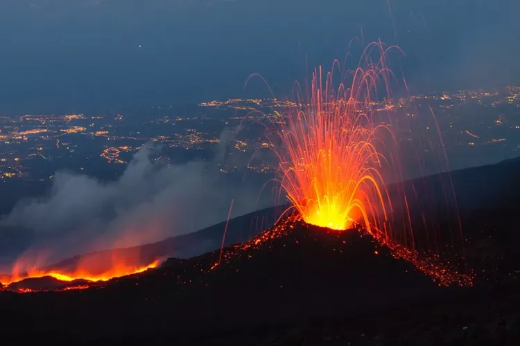 Majestic panoramic landscape of Mount Etna surrounded by scenic Sicilian countryside.